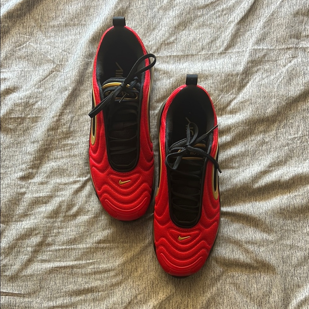 Red Nike Sneakers with Black and Gold Accents